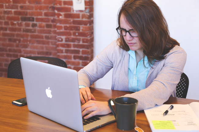 Woman at computer looking unhappy